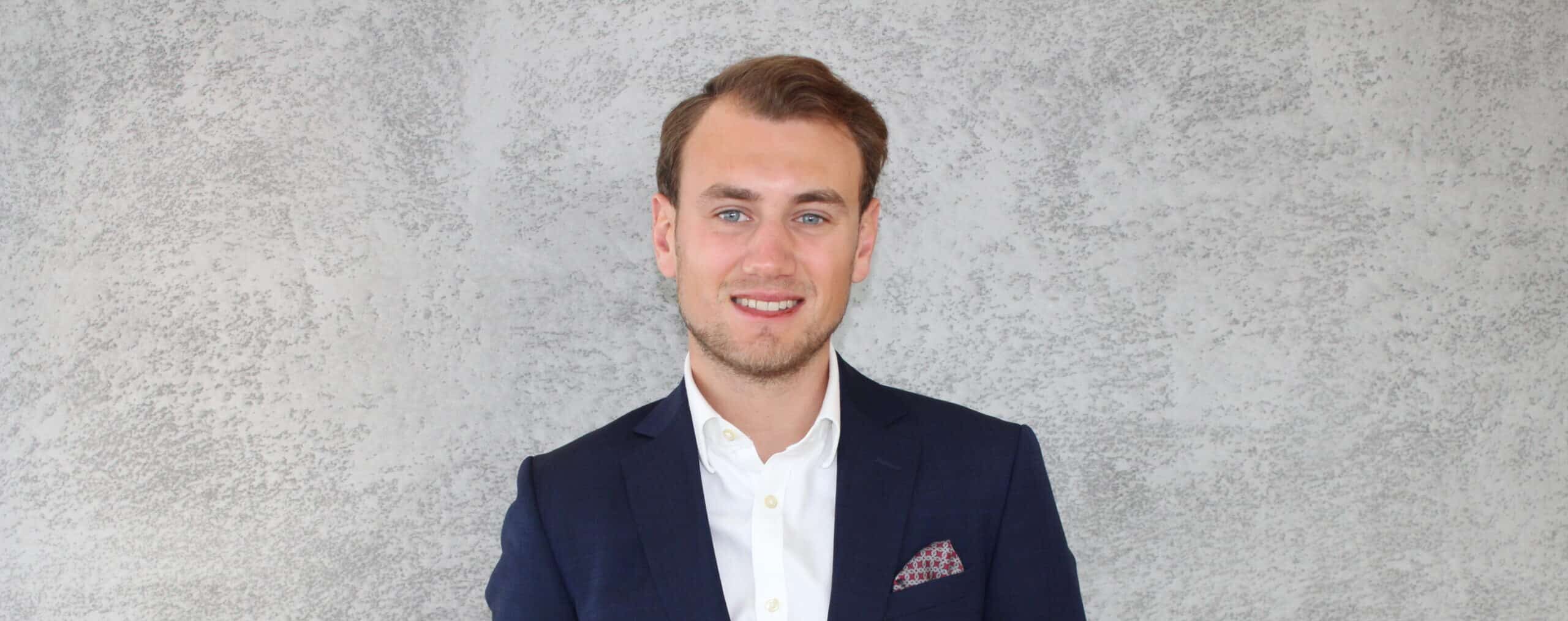 Headshot of Alexander Charles smiling